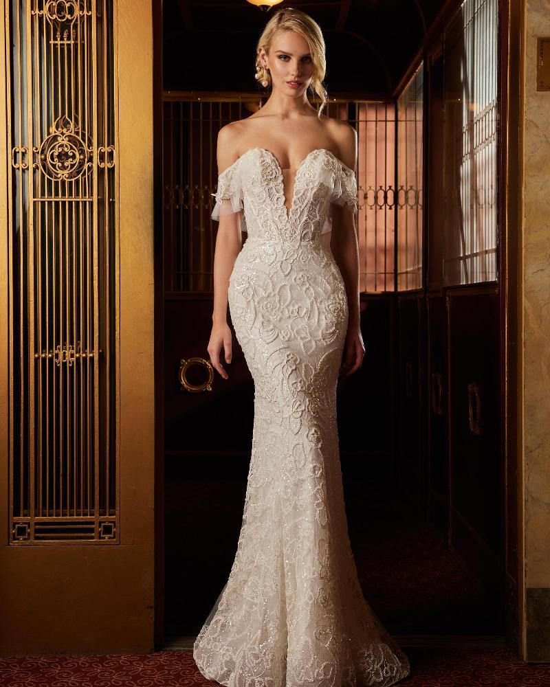 122109 fitted sparkly wedding dress with sleeves and plunging neckline3